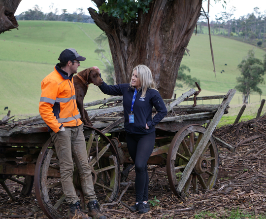 RFDS Tasmania physical health worker with farmer and dog