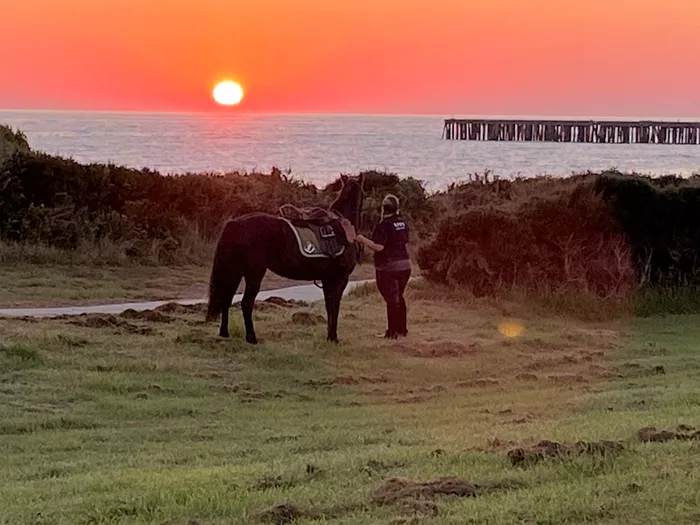 King island Fundraiser with her horse at sunset